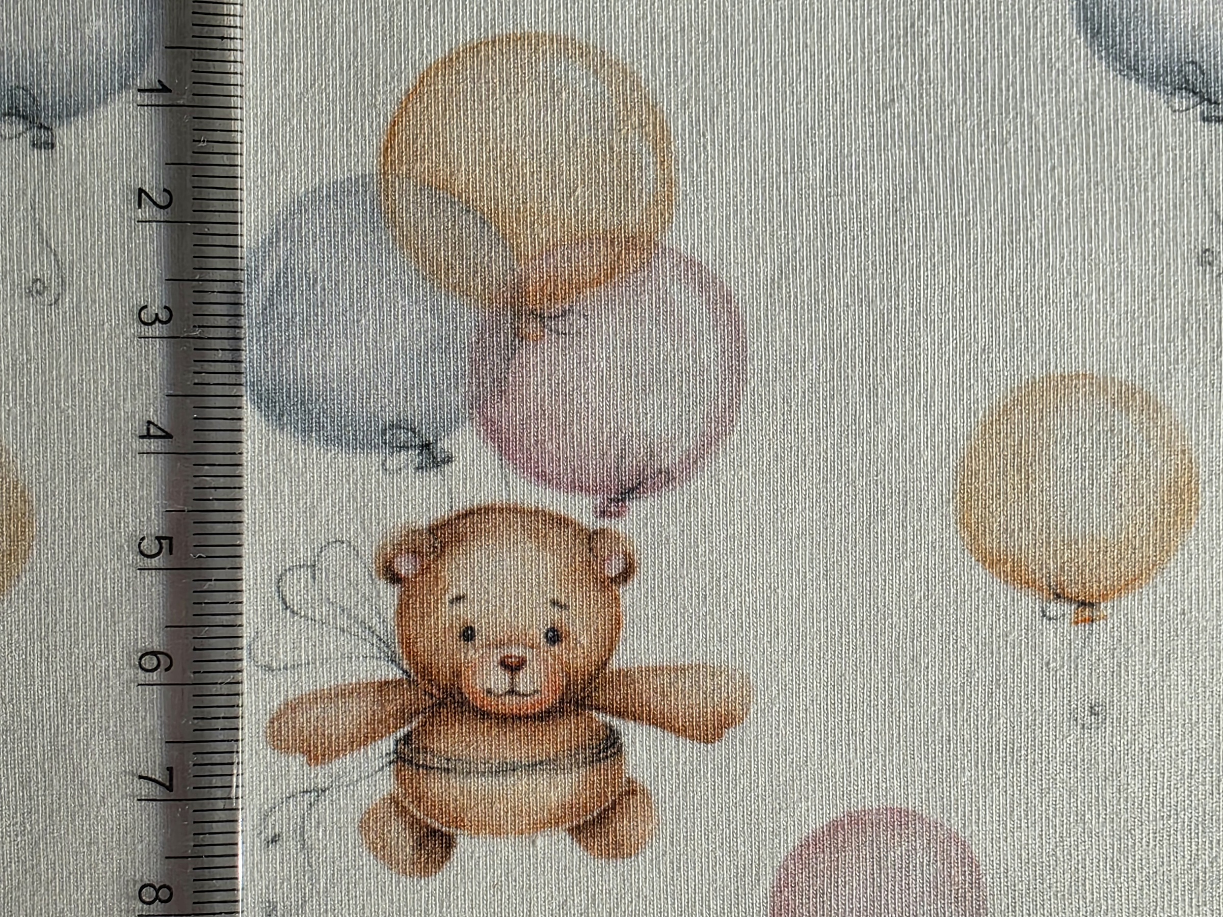 Macis, lufis gyerekmintás pamut jersey anyag közelről, hogy jól látszódjon a méret